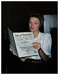 Judy Garland records "Smilin' Through" for Decca Records in July 1945